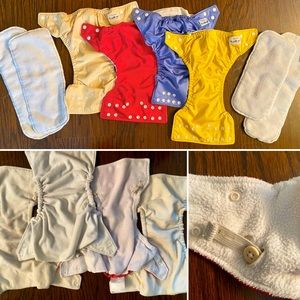 Four Fuzzibuns pocket cloth diapers w pads